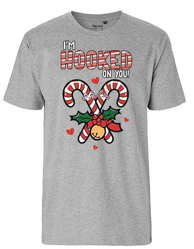 I'm hooked on you - christmas, candy canes, holly, bell, hearts, festive, typography, winter, holiday, fun - Fairtrade T-Shirt
